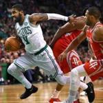 Boston-12/28/2017 Boston Celtics vs Houston Rockets- Celtics Kyrie Irving powers past Rockets Eric Gordon as he drives to the basket for two points in the 1st qtr. John Tlumacki/Globe staff (sports)