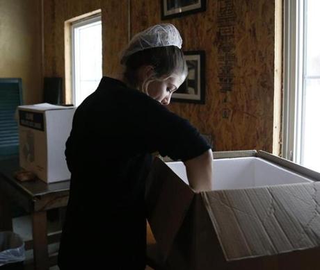 Marisa Mauro packed up a box of butter at the historic Bragg Farm. 
