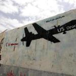 In 2015, a Yemeni man looks at graffiti that showed a US drone after Al Qaeda in Yemen confirmed the death of its leader in US drone strike, in Sana'a, Yemen. 