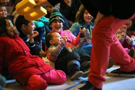 Xander Delapena (third from left), 3, and Ava Fontaine, 9, enjoyed a performance at the Boston Public Library.
