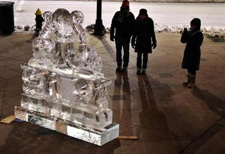 Pedestrians stopped briefly to admire an ice sculpture of an octopus.
