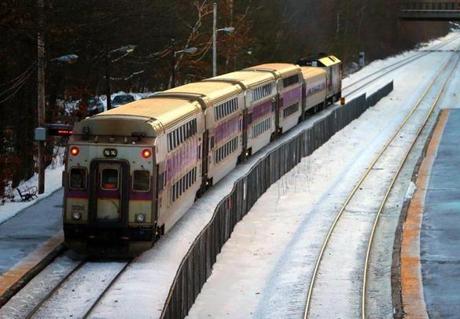 Wellesley, MA - 1/03/17 - An outbound MBTA commuter rail train drops off passengers at the Wellesley Farms stop. (Lane Turner/Globe Staff) Reporter: (vaccaro) Topic: (04mbtaprep)
