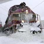 Gloucester, MA: 01-04-2018: Rockport bound MBTA commuter rail train pushed aside snow crossing Washington St. in Gloucester, Mass. during snow storm Jan. 4, 2018. Photo/John Blanding, Boston Globe staff story/ ( )