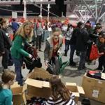 12/16/2017 Boston Ma- Medford Girl Scout Troop Leader Monique O'Connell () left and her daughter Marianne O'Connell () right volunteering for a charity event at the Boston Convention Center. Jonathan Wiggs\Globe Staff Reporter:Topic. 