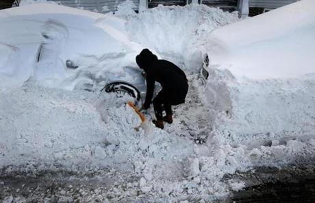 BOSTON, MA - 1/05/2018: Shovel Out...Kathleen O'Day shovels out her car for a second time on E Sixth Street South Boston (David L Ryan/Globe Staff ) SECTION: METRO TOPIC 06bostonsnowpic
