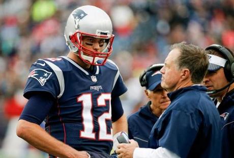 FOXBORO, MA - OCTOBER 29: Head coach Bill Belichick of the New England Patriots talks with Tom Brady #12 during the fourth quarter of a game against the Los Angeles Chargers at Gillette Stadium on October 29, 2017 in Foxboro, Massachusetts. (Photo by Jim Rogash/Getty Images)
