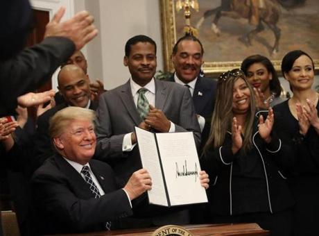 President Trump received applause from members of the African-American community after signing a proclamation Friday to honor Martin Luther King Jr. Day.
