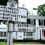 Hingham 06/22/2016 : A sign points in all directions infront of the Talbots store on North street in Hingham. Photo by Debee Tlumacki for the Boston Globe (regional) 