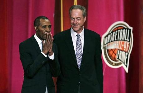 Basketball Hall of Fame inductee Jo Jo White pauses to acknowledge applause during the enshrinement ceremony for the Class of 2015 of the Naismith Memorial Basketball Hall of Fame in Springfield, Mass., Friday, Sept. 11, 2015. At right is White's Boston Celtics teammate, Hall of Famer Dave Cowens. (AP Photo/Charles Krupa)
