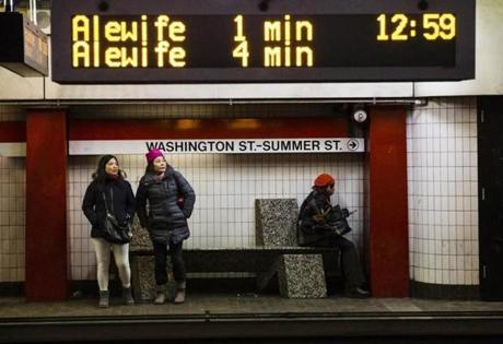 Passengers waited on the platform for a Red line train at the Downtown Crossing station in Boston Friday.
