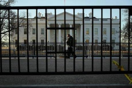 A US Secret Service officer walked past barricades on the north side of the White House Saturday.
