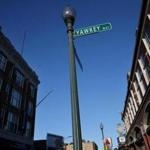 (FOR SPOTLIGHT SERIES) BOSTON, MA- NOVEMBER 21, 2017- : Yawkey Way and Brookline Ave at Fenway Park in Boston, MA on November 21, 2017. (It pays homage to former Sox owner Tom Yawkey, who kept his team all-white longer than anyone else, passing up chances to hire future Hall of Famers Jackie Robinson and Willie Mays along the way. No other professional sports franchise plays near a street named for such a racially divisive figure. ) CRAIG F. WALKER/GLOBE STAFF) section: spotlight reporter: