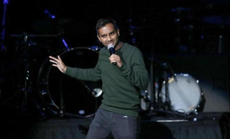 Comedian Aziz Ansari performs during a community concert at the Obama Foundation Summit Wednesday, Nov. 1, 2017, in Chicago. (AP Photo/Charles Rex Arbogast)
