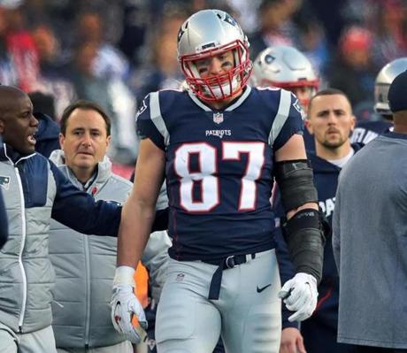 Foxborough, MA - 1/21/2017 - Patriots tight end Rob Gronkowski is escorted to the locker room after being hit in the head on a play late in the 2nd quarter of the AFC Championship playoff game between the New England Patriots and the Jacksonville Jaguars at Gillette Stadium. (Jim Davis/Globe staff)
