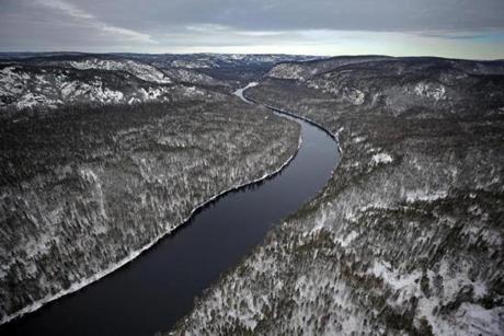 The Betsiamites River winds through forests and mountains to the Bersimis-1 dam in Quebec.
