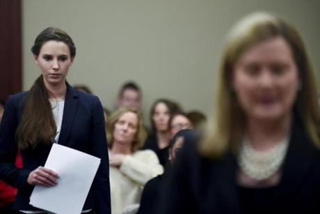 Rachael Denhollander, left, is introduced by Assistant Attorney General Angela Povaliatis, before she makes the final victim impact statement, during Larry Nassar's sentencing hearing Wednesday, Jan. 24, 2018 in Lansing, Mich. The former sports doctor who admitted molesting some of the nation's top gymnasts for years was sentenced Wednesday to 40 to 175 years in prison as the judge declared: 