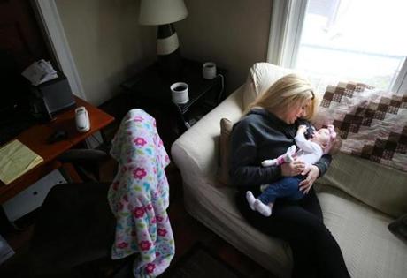 Dajia Brown careD for her baby Brooklyn at their home in Somerville. Dajia and her baby are part of a Boston Medical Center program that helps women maintain their sobriety and take care of themselves and their babies. 
