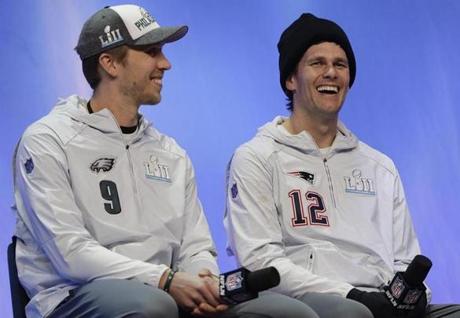 Philadelphia Eagles' Nick Foles and New England Patriots' Tom Brady answer questions during NFL football Super Bowl 52 Opening Night Monday, Jan. 29, 2018, at the Xcel Center in St. Paul, Minn. (AP Photo/Eric Gay)
