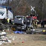 Emergency personnel worked at the scene of a train crash involving a garbage truck in Crozet, Va., on Wednesday.