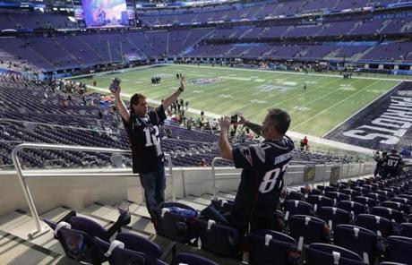 SUPER BOWL SLIDER1 Minneapolis, MN - 2/4/2018 - Bill Yetman of Attleboro takes a picture of friend Ken Swerdlick from CT before Super Bowl LII. The New England Patriots play the Philadelphia Eagles in Super Bowl LII at US Bank Stadium in Minneapolis on Feb. 4, 2018. (Bill Greene/Globe staff)
