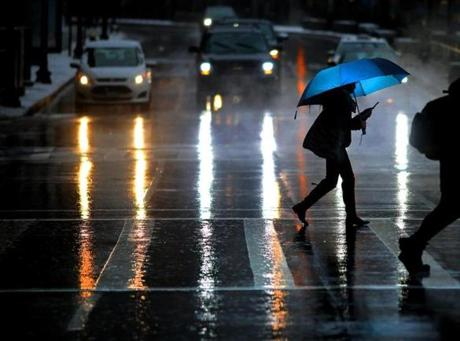 Boston, MA - 02/07/18 - Pedestrians crossed Congress Street as a snowfall turned over to rain in Boston (Lane Turner/Globe Staff) Reporter: () Topic: ()
