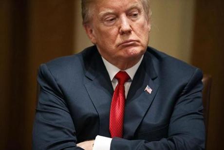 President Donald Trump listens during a meeting with law enforcement officials on the MS-13 street gang and border security, in the Cabinet Room of the White House, Tuesday, Feb. 6, 2018, in Washington. (AP Photo/Evan Vucci)
