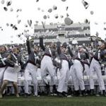 FILE - In this May 21, 2016, file photo, graduates toss their caps in the air at the end of a graduation and commissioning ceremony at the U.S. Military Academy in West Point, N.Y. The number of sexual assaults reported at the U.S. Military Academy roughly doubled during the last school year, according to data reviewed by The Associated Press, in the latest example of the armed forces' persistent struggle to root out such misbehavior. It's the fourth year in a row that sexual assault reports increased at the school in West Point. There were 50 cases in the school year that ended last summer, compared with 26 made during the 2015-2016 school year. By comparison, the U.S. Naval Academy in Annapolis, Md., and the U.S. Air Force Academy in Colorado Springs, Colo., saw only slight increases. (AP Photo/Mike Groll)