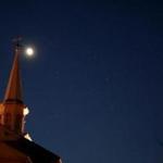 The First Congregational Church in Hanover under the moon, planets, and stars before sunrise looking south.
