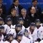 The first lady Kim Jung-sook, from left, South Korean President Moon Jae-in, IOC president Thomas Bach, North Korea's nominal head of state Kim Yong Nam and Kim Yo Jong, sister of North Korean leader Kim Jong Un, take a group photo with the combined Koreas team after the team's preliminary round of the women's hockey game against Switzerland at the 2018 Winter Olympics in Gangneung, South Korea, Saturday, Feb. 10, 2018. (AP Photo/Jae C. Hong)