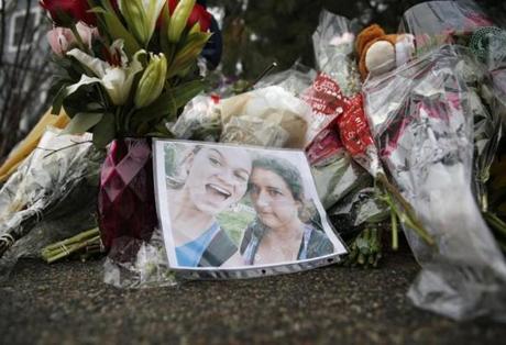 A photograph rested against bouquets left at a makeshift memorial for two Needham High School students, Talia Newfield and Adrienne Garrido.
