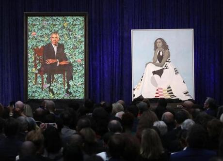 Newly unveiled portraits of former president Barack Obama and first lady Michelle Obama. 
