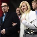 FILE - In this Friday, Jan. 20, 2017, file photo, then Treasury Secretary-designate Stephen Mnuchin and his then-fiancee, Louise Linton, arrive on Capitol Hill in Washington, for the presidential inauguration of Donald Trump. Linton offered a condescending response to a social media critic on Aug. 21, 2017, telling a mother of three that that she was ?adorably out of touch.? Mnuchin and Linton were married in June. (Saul Loeb/Pool Photo via AP, File)