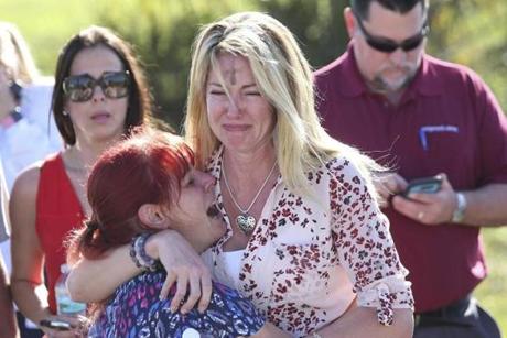 Parents waited for news after a shooting at Marjory Stoneman Douglas High School in Parkland, Fla., on Wednesday.
