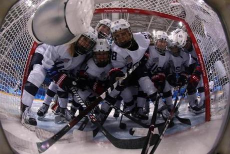 TOPSHOT - The US team poses for a photo before the women's preliminary round ice hockey match between the US and Canada during the Pyeongchang 2018 Winter Olympic Games at the Kwandong Hockey Centre in Gangneung on February 15, 2018. / AFP PHOTO / POOL / David CernyDAVID CERNY/AFP/Getty Images
