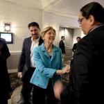 Senator Elizabeth Warren greeted Ernie Stevens, Jr., the Chairman and national spokesperson for the National Indian Gaming Association (NIGA), before she spoke at the Congress of American Indians on Wednesday.
