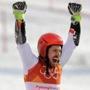 Austria's Marcel Hirscher who took the gold celebrates during the flower ceremony for the men's giant slalom at the 2018 Winter Olympics in Pyeongchang, South Korea, Sunday, Feb. 18, 2018. (AP Photo/Michael Probst)