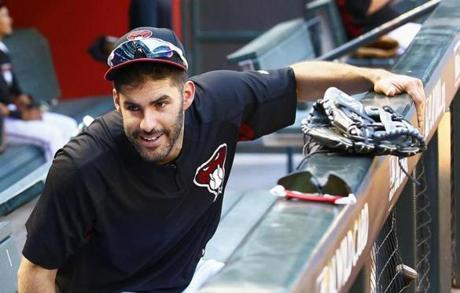 FILE - In this Oct. 2, 2017, file photo, Arizona Diamondbacks right fielder J.D. Martinez smiles as he talks with another player during practice at Chase Field for a National League wild-card playoff baseball game in Phoenix. A person familiar with the negotiations says slugger Martinez and the Boston Red Sox have agreed to a $110 million, five-year contract. The person spoke to The Associated Press on condition of anonymity Monday, Feb. 19, 2018, because the agreement was subject to a successful physical and had not been announced. (AP Photo/Ross D. Franklin, File)
