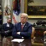 Florida Attorney General Pam Bondi, right, and President Donald Trump listen as Indiana Attorney General Curtis Hill speaks during a meeting with state and local officials to discuss school safety, in the Roosevelt Room of the White House, Thursday, Feb. 22, 2018, in Washington. (AP Photo/Evan Vucci)