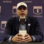 FIEL - In this Feb. 19, 2017, file photo, Tony Clark, executive director of the Major League Players Association, answers questions at a news conference in Phoenix. A proposal collapsed that would have put a runner on second base to start the 10th inning of spring training games, a person familiar with the negotiations told The Associated Press. The person spoke on condition of anonymity Friday because no statements were authorized. Management thinks the union backed off because players were upset Commissioner Rob Manfred described new pace-of-game rules that apply to the regular season as an agreement, the person said. (AP Photo/Morry Gash, File)