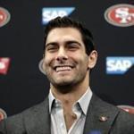 San Francisco 49ers quarterback Jimmy Garoppolo, right, shakes hands with general manager John Lynch during an NFL football press conference Friday, Feb. 9, 2018, in Santa Clara, Calif. Garoppolo has signed a five-year contract with the 49ers worth a record-breaking $137.5 million. (AP Photo/Marcio Jose Sanchez)