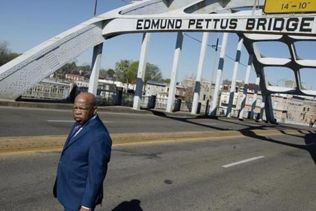 Congressman John Lewis stands on the Edmund Pettus Bridge on Sunday, March 4, 2018, in Selma, Ala., during the annual commemoration of 