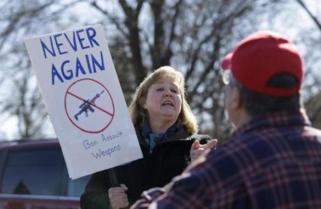 Protesters on both sides of the gun issue appeared at a gun show in Wheaton, Ill., on Sunday. A Globe photographer was not allowed to take photos at a gun show in Massachusetts on Saturday.
