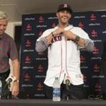 Fort Myers, FL- 2/26/2018 - Red Sox Spring Training- J.D. Martinez puts on his new Red Sox jersey as Boston Red Sox general manager Dave Dombrowski and agent Scott Boras are all smiles during a press conference announcing his signing at jetBlue Park at Fenway South in Fort Myers, Fla., on Feb. 26, 2018. (Stan Grossfeld/Globe Staff)