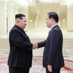 A photo released by North Korea's official Korean Central News Agency shows North Korean leader Kim Jong-Un  shaking hands with South Korean chief delegator Chung Eui-yong, who travelled as envoys of the South's President Moon Jae-in, during their meeting in Pyongyang Tuesday.