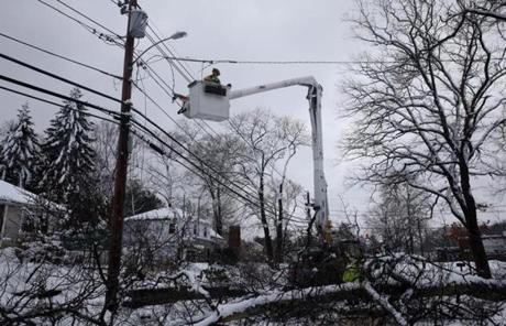 Westwood, MA- March 08, 2018: Lineman Jim Wisner, of Indianapolis Power and Light, works on restoring power after a tree took down lines on Gay Street in Westwood, MA on March 08, 2018. (Globe staff photo / Craig F. Walker) section: metro reporter: 
