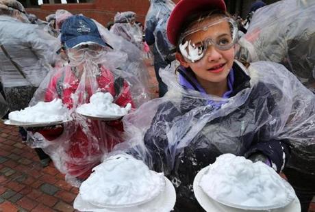 Olivia Wells, 10 (left), and Emily Grenadine, 11, both from Methuen, had their pies ready to throw at City Hall Plaza.
