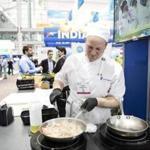 Chef Tim Fahey made shrimp for visitors at the seafood convention at the Boston convention center Tuesday.
