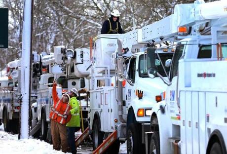 Orleans-03/14/18- Electric utility trucks from New York worked on power lines on Main Street in Orleans, where many people in that town alone were without power. Thousands were still without power after another Nor'easter blanketed Cape Cod with heavy snow. John Tlumacki/Globe Staff(metro)
