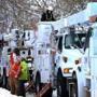 Electric utility trucks from New York worked on power lines on Main Street in Orleans Wednesday.  