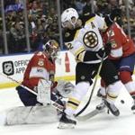 Florida Panthers goaltender James Reimer, left stops a shot by Boston Bruins' David Backes (42) during the first period of an NHL hockey game, Thursday, March 15, 2018, in Sunrise, Fla. (AP Photo/Lynne Sladky)